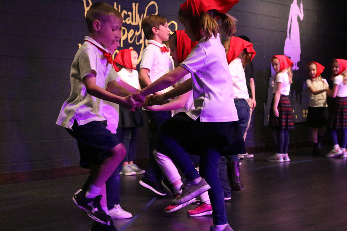 pair of children dancing