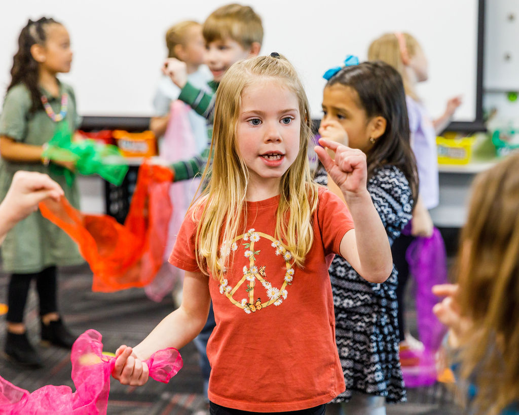 Scattering seeds through the wind, second-graders dance the plant life cycle at Silver Lake Elementary School
